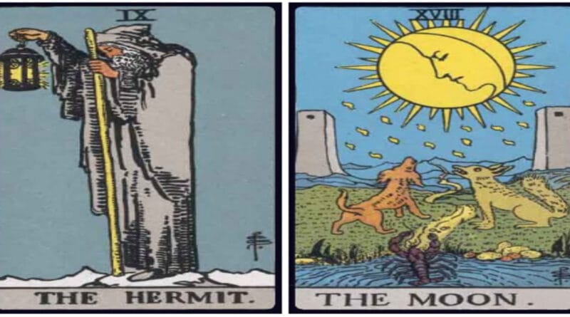 Hermit and Moon birth cards side by side on a dark wooden table in a tarot reading setup